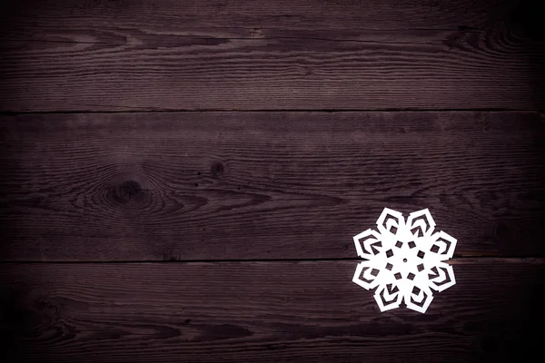 Різдвяний дерев'яний фон зі сніжинками — стокове фото