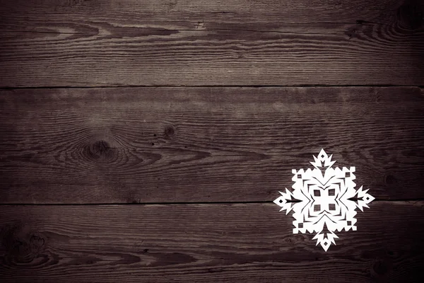 Vánoční dřevěné pozadí se sněhové vločky — Stock fotografie