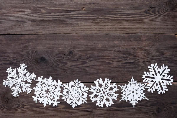 Christmas gränsen - trä bakgrund med snöflingor — Stockfoto