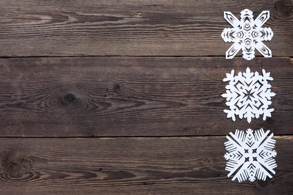 Christmas gränsen - trä bakgrund med snöflingor — Stockfoto