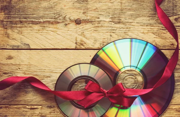 Two cd disks and ribbon — Stock Photo, Image