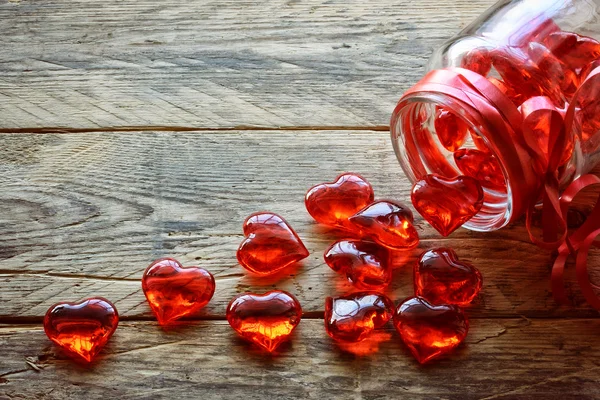 Glass jar with red translucent heart — Stock Photo, Image