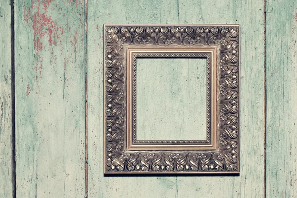 Frame on wooden background — Stock Photo, Image