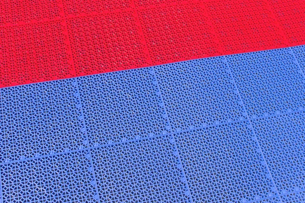 Rode en blauwe kunststof textuur als achtergrond — Stockfoto
