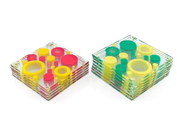 Coasters coloridos para vidro isolado em branco — Fotografia de Stock