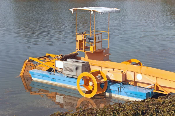 Machine boat for cleaning river rubbish and plants — Stock Photo, Image