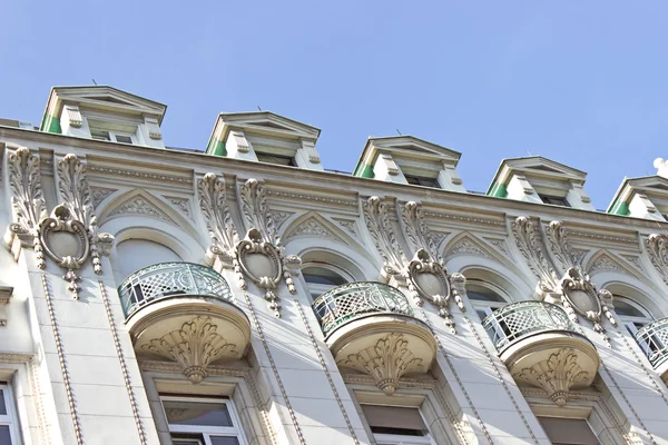 Balconies on old ornate building over sky — Stock Photo, Image