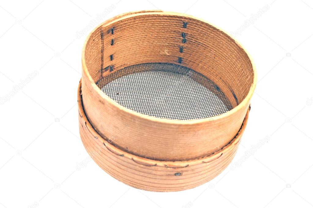 Old wooden sieve for flour isolated on white