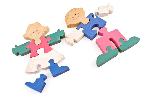 Colorful wooden girl and boy puzzle pieces isolated on white — Stock Photo, Image