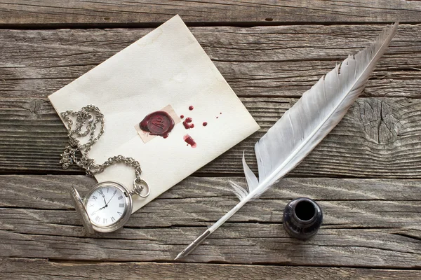 Wax sealed letter with quill on wooden background — Stock Photo, Image