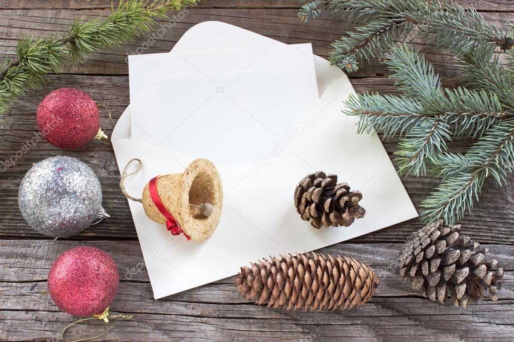 Pine cones, needles and Christmas balls on wooden background