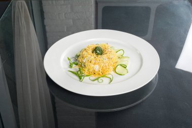 Quails nest salad shot on black background with reflection