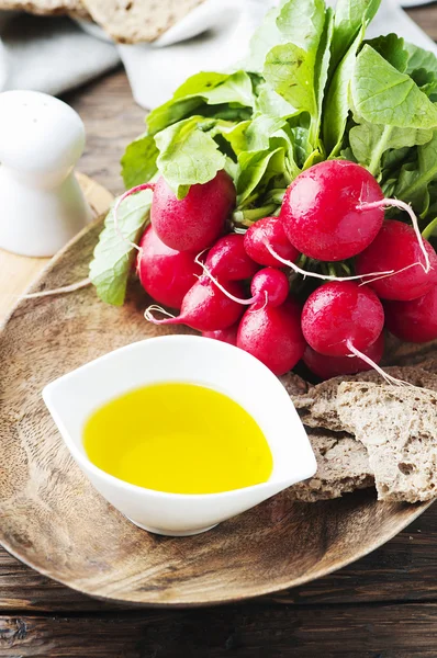 Fresh radishes with olive oil — Stock Photo, Image