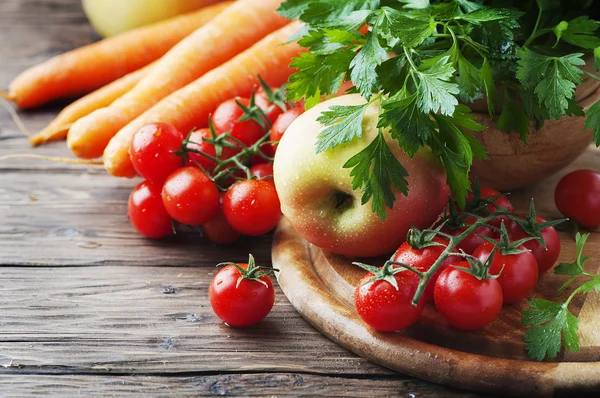 Healthy food with tomatoes and apple — Stock Photo, Image