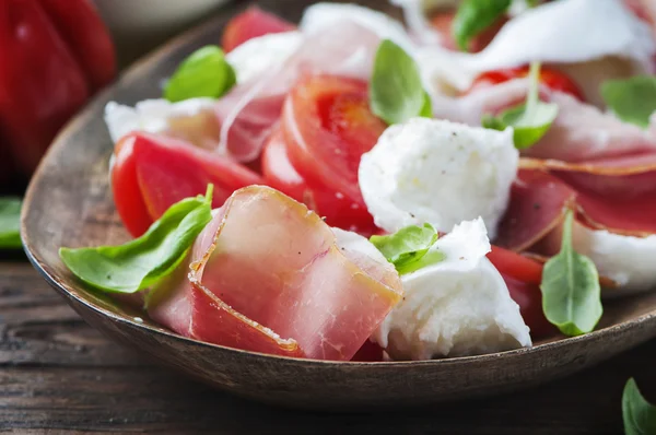Italian salad caprese with ham, basil and mozzarella — Stock Photo, Image