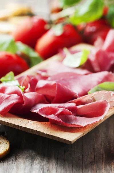 Appetizer with italian bresaola — Stock Photo, Image