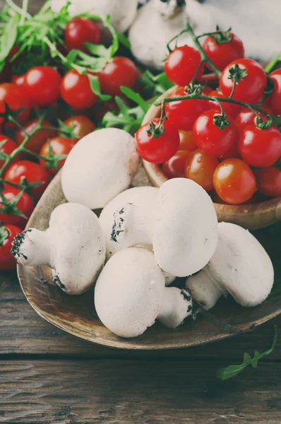 Cherry tomatoes and champignons — Stock Photo, Image