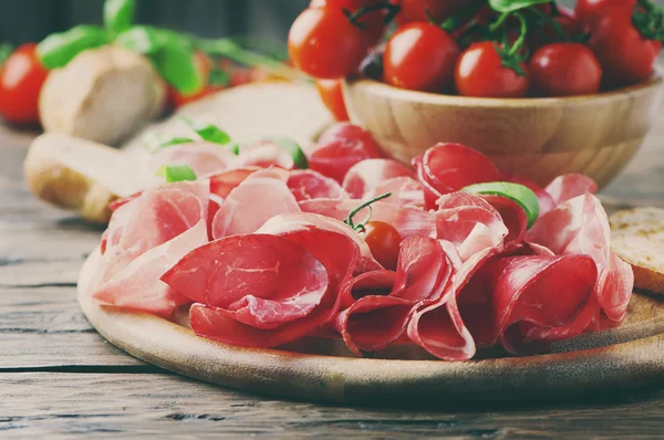 Antipasto with ham and bresaola — Stock Photo, Image