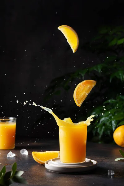 Splash of orange juice on the bark background, selective focus image