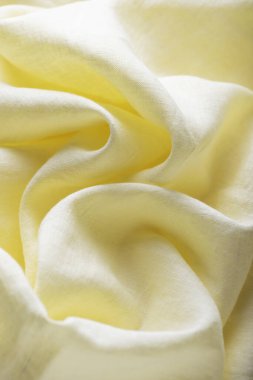 Keten kumaşın arka plan dokusu sarı renkte. Dikiş konsepti