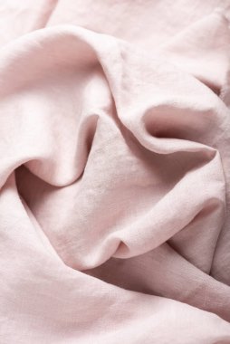 Doğal açık pembe renkte keten kumaşın arkaplan dokusu. Dikiş konsepti