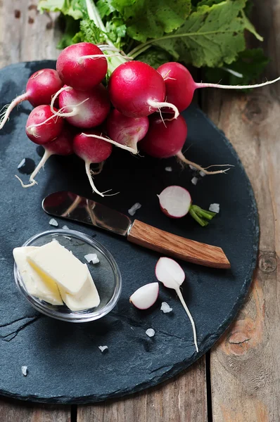 Fresh radish, butter and salt on the wooden table — Stock Photo, Image