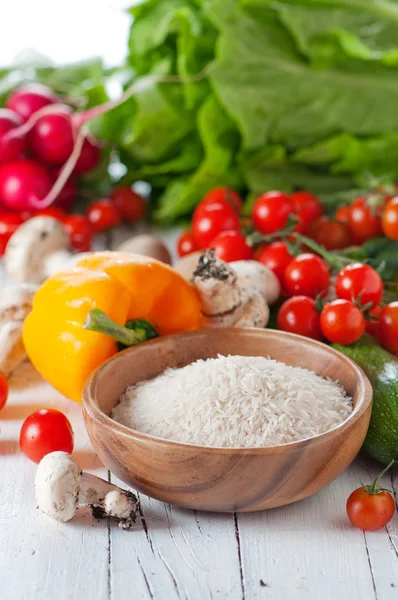 Rice with raw vegetables — Stock Photo, Image