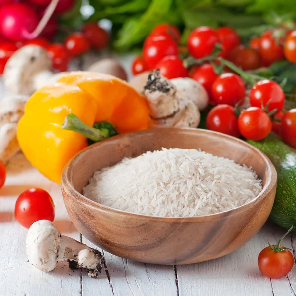 Rice in bowl with vegetables — Stock Photo, Image