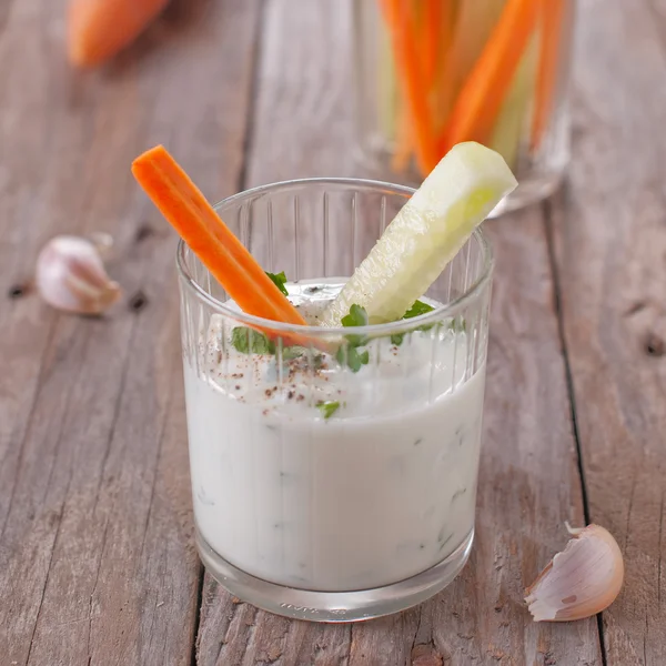 Vegetables and yoghurt in glass — Stock Photo, Image