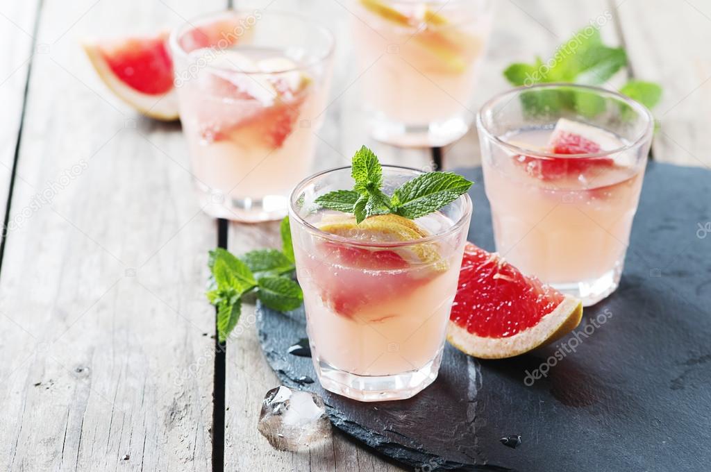 Pink cocktail with ice and mint