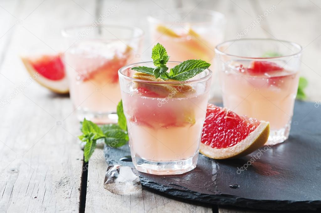 Pink cocktail with ice and mint