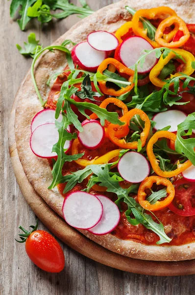 Vegan pizza with radish and paprika