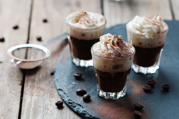 Delicious coffee with cream and cocoa — Stock Photo, Image