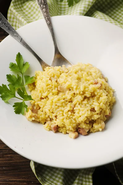 Italian traditional risotto with saffron and ham — Stock Photo, Image