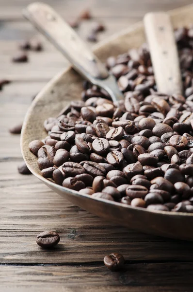 Raw coffee beans on wooden table