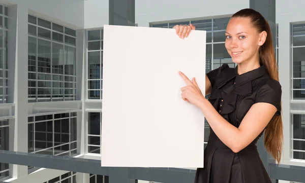 Businesswoman holding empty paper