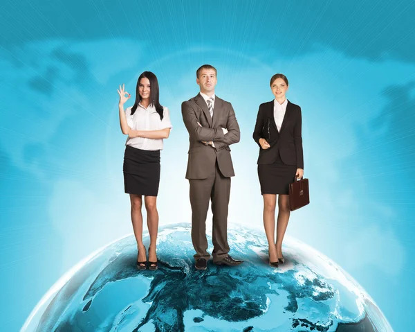 Business people in suit standing on Earth surface