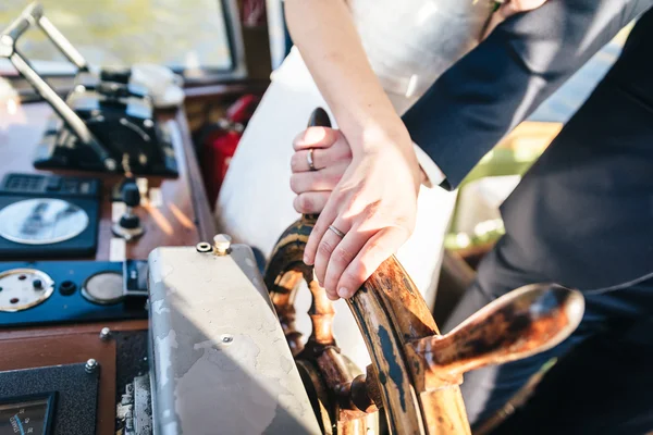 Bride and Grooms Hand and on a Steering Wheel — Stock Photo, Image