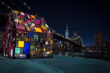 Colorful image of the Manhattan skyline seen from a park in  Dumbo, Brooklyn, Besides the Brooklyn Bridge you can also see Lower Manhattan, home of the Financial District that house Wall st and numerous Banks