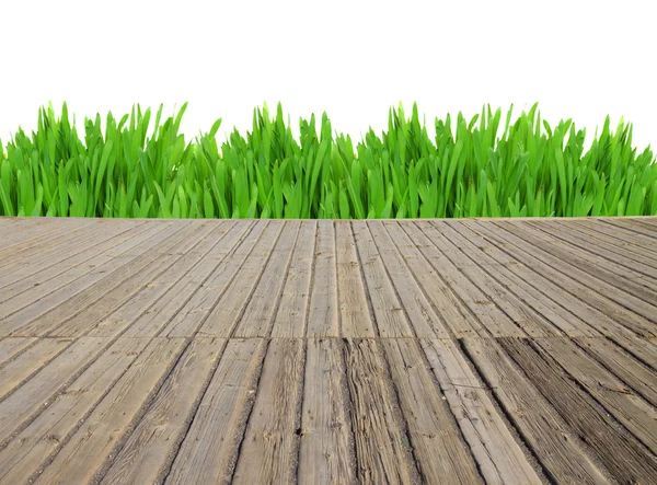 Pranchas de madeira e grama — Fotografia de Stock