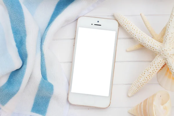 Phone with beach towel and seashells — Stock Photo, Image