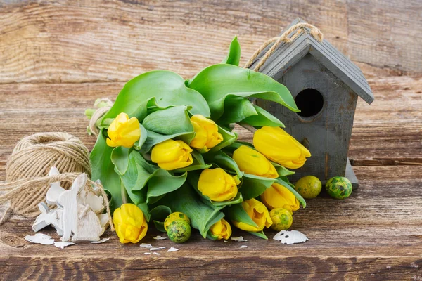 Yellow tulips  with birdcage — Stock Photo, Image