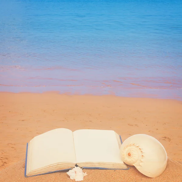 Open book on a sea shore — Stock Photo, Image