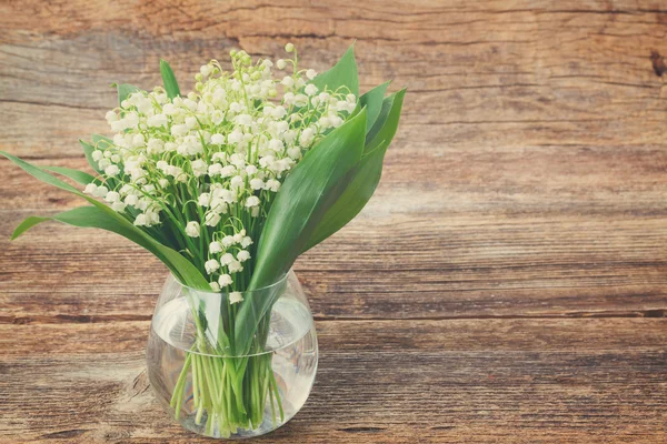 Lilly of valley on wood — Stock Photo, Image
