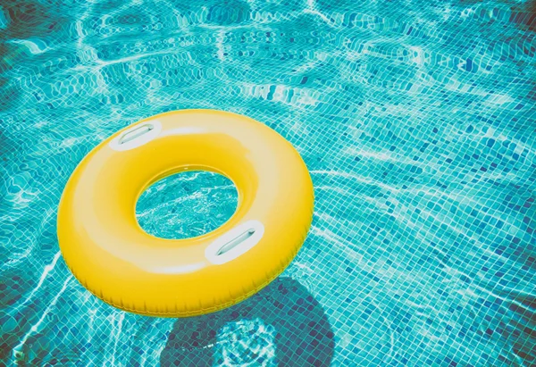Rubber ring in pool — Stock Photo, Image