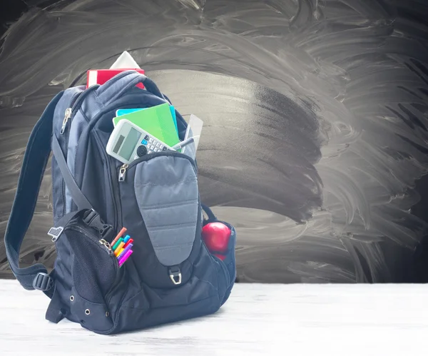 School backpack with supplies — Stock Photo, Image
