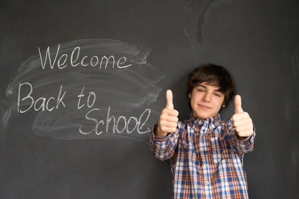 Boy and back to school black board — Stock Photo, Image