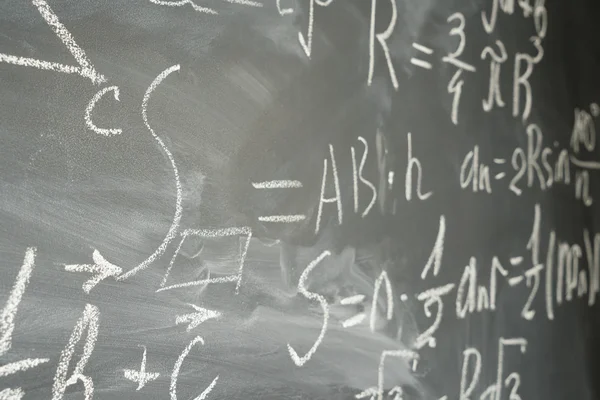 Math formulas on black board — Stock Photo, Image