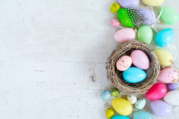 Easter colored eggs with tulips — Stock Photo, Image