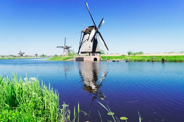 dutch windmill over river waters